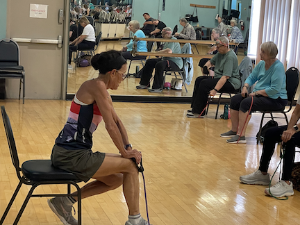 Fitness instructor Rosanne Hopson leading class.