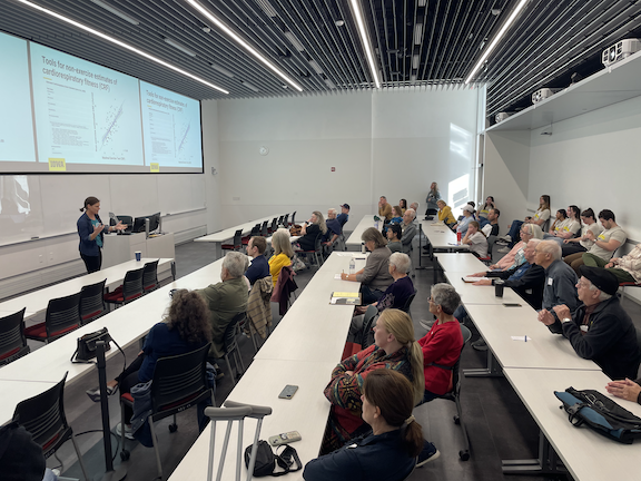 Open house attendees listen to Dr. Michelle Voss