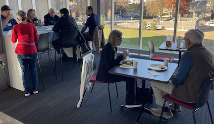 Attendees mingle over snacks