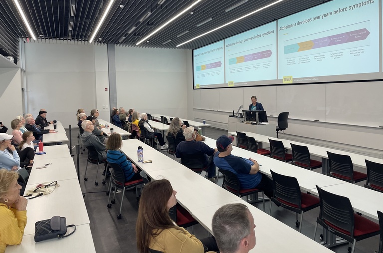 Attentive guests fill a classroom at the Health, Brain &Cognition Lab open house.