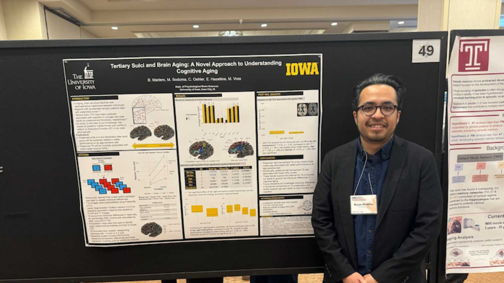 Bryan Madero at conference with poster