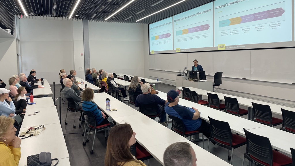 Attentive guests fill a classroom at the Health, Brain &Cognition Lab open house.