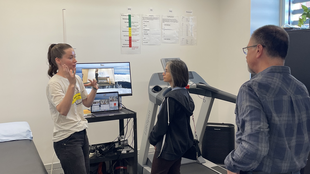 Olivia Hinklin explains exercise techniques to visitors at the HBC Lab open house in November.